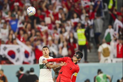 South Korea beats Portugal 2-1; both advance in World Cup soccer